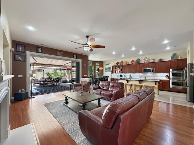 10555 Hampton Creek Dr, Reno, NV 89521 - living area with ceiling fan, light wood finished floors, and recessed lighting
