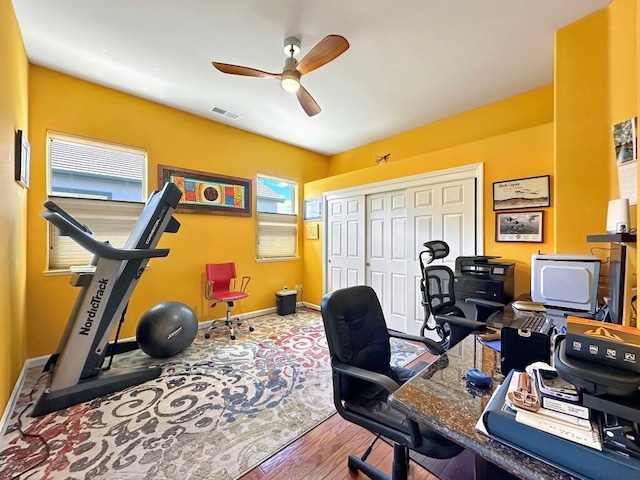 10555 Hampton Creek Dr, Reno, NV 89521 - home office featuring a ceiling fan, wood finished floors, and baseboards