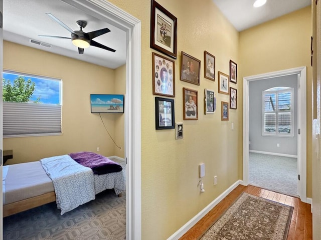 10555 Hampton Creek Dr, Reno, NV 89521 - bedroom featuring wood finished floors, baseboards, and ceiling fan