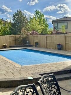 10555 Hampton Creek Dr, Reno, NV 89521 - view of pool with a fenced backyard and a patio area