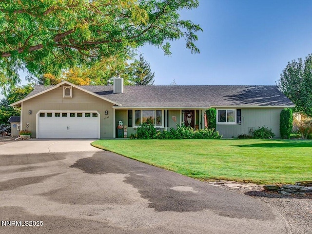 1992 Hackamore Ln, Gardnerville, NV 89410 - ranch-style house with a chimney, driveway, an attached garage, and a front lawn
