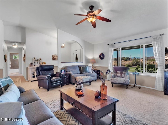 1992 Hackamore Ln, Gardnerville, NV 89410 - living area with light carpet, vaulted ceiling, a ceiling fan, arched walkways, and baseboards