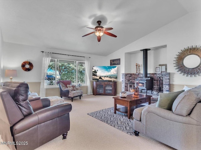1992 Hackamore Ln, Gardnerville, NV 89410 - living room with vaulted ceiling, ceiling fan, carpet floors, and a wood stove