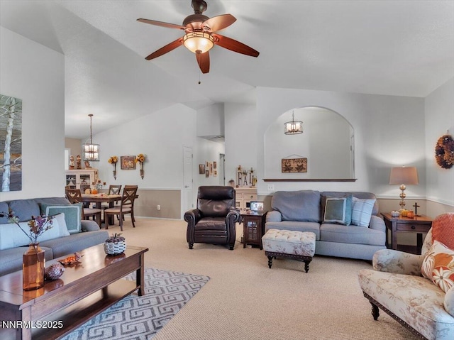 1992 Hackamore Ln, Gardnerville, NV 89410 - carpeted living area with vaulted ceiling, ceiling fan, a chandelier, and arched walkways