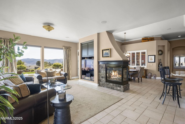 2698 Wind Feather Trl, Reno, NV 89511 - living area with a multi sided fireplace, light tile patterned flooring, and baseboards