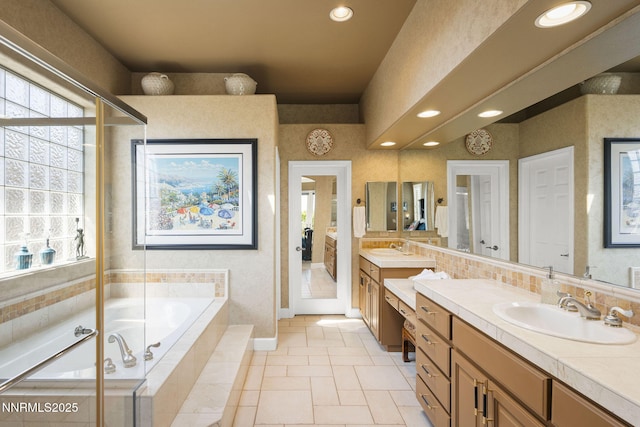 2698 Wind Feather Trl, Reno, NV 89511 - full bath featuring vanity, a garden tub, recessed lighting, tile patterned floors, and baseboards