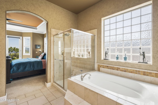 2698 Wind Feather Trl, Reno, NV 89511 - full bathroom with ensuite bath, a garden tub, a shower stall, plenty of natural light, and ornamental molding