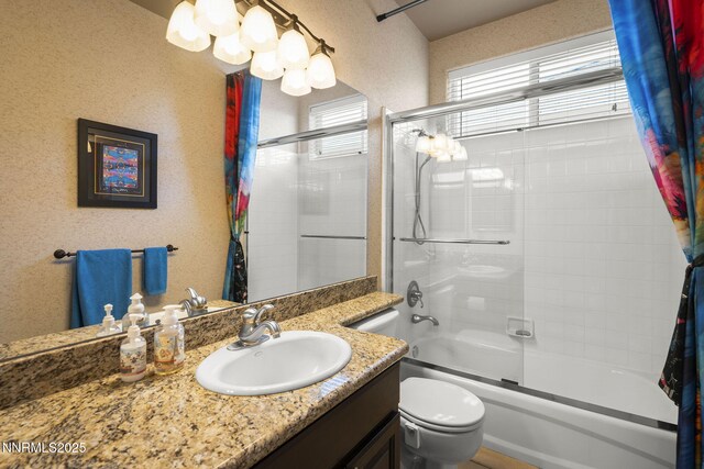 2698 Wind Feather Trl, Reno, NV 89511 - bathroom featuring vanity, enclosed tub / shower combo, and toilet