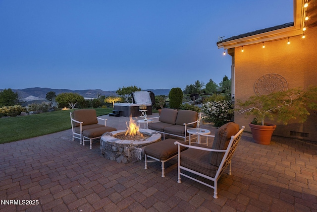 2698 Wind Feather Trl, Reno, NV 89511 - view of patio with a mountain view and an outdoor living space with a fire pit