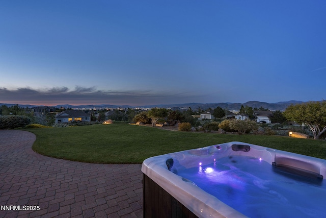 2698 Wind Feather Trl, Reno, NV 89511 - view of patio featuring a hot tub and a mountain view