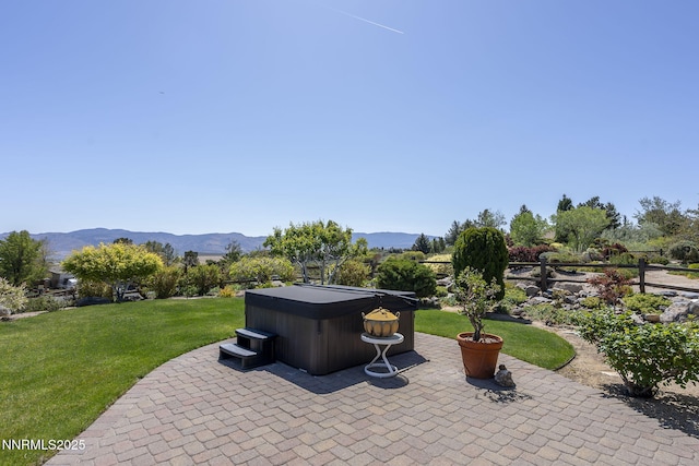 2698 Wind Feather Trl, Reno, NV 89511 - view of patio with a hot tub and a mountain view