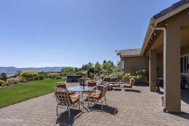 2698 Wind Feather Trl, Reno, NV 89511 - view of patio / terrace with a mountain view and outdoor dining area