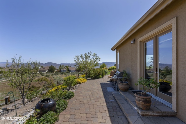 2698 Wind Feather Trl, Reno, NV 89511 - view of patio / terrace with a mountain view and grilling area