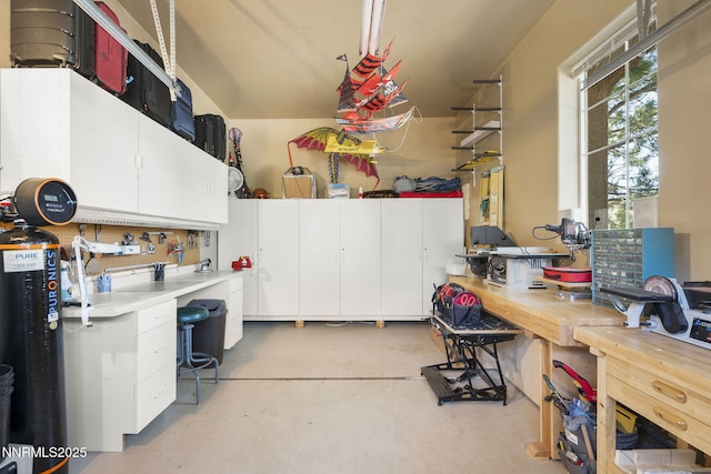 2698 Wind Feather Trl, Reno, NV 89511 - miscellaneous room featuring a workshop area, concrete flooring, and an office area