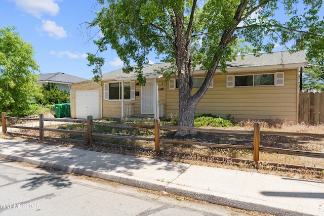 2480 Courtland Way, Sparks, NV 89431 - ranch-style home featuring a garage, a fenced front yard, and driveway