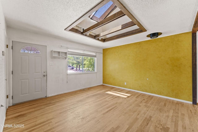 2480 Courtland Way, Sparks, NV 89431 - foyer with a textured ceiling, light wood-style flooring, and baseboards