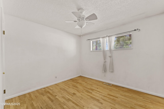 2480 Courtland Way, Sparks, NV 89431 - unfurnished room featuring wood finished floors, a textured ceiling, a ceiling fan, and baseboards