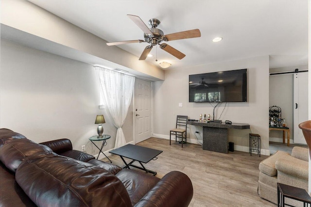 2249 Kietzke Ln Apt C, Reno, NV 89502 - living area with a ceiling fan, wood finished floors, baseboards, a barn door, and recessed lighting