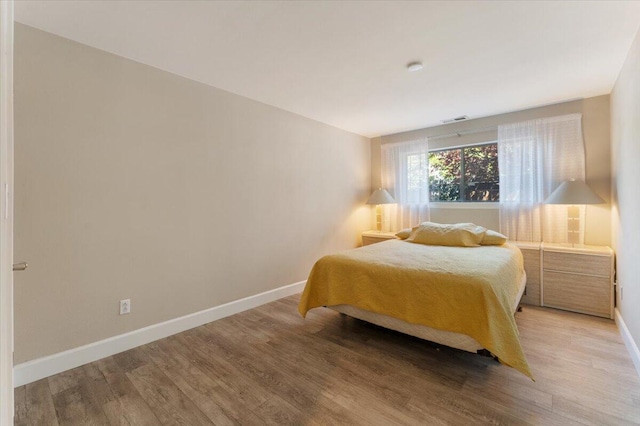 2249 Kietzke Ln Apt C, Reno, NV 89502 - bedroom with light wood finished floors and baseboards