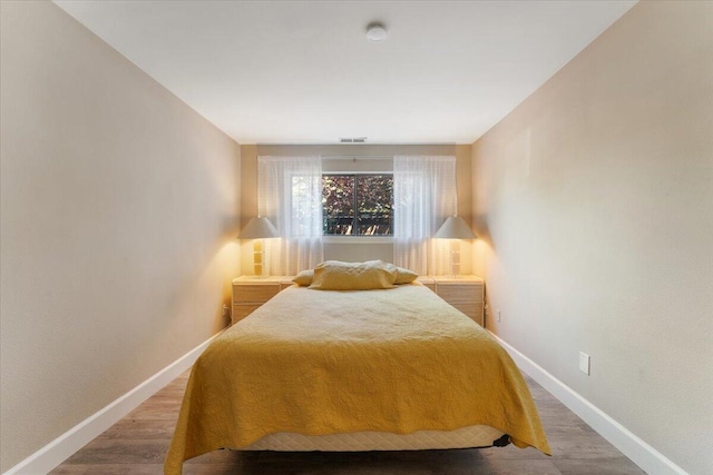 2249 Kietzke Ln Apt C, Reno, NV 89502 - bedroom featuring baseboards and wood finished floors