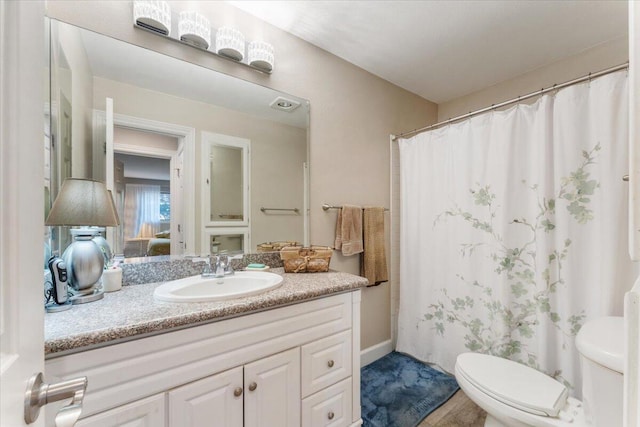 2249 Kietzke Ln Apt C, Reno, NV 89502 - full bath featuring toilet, vanity, and a shower with shower curtain