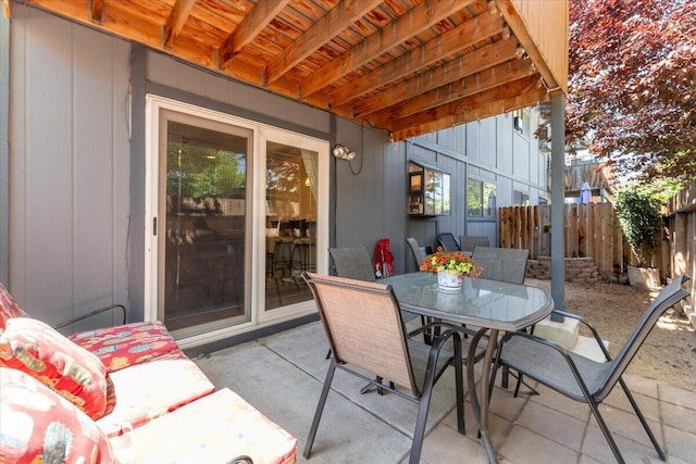 2249 Kietzke Ln Apt C, Reno, NV 89502 - view of patio / terrace featuring outdoor dining area and fence