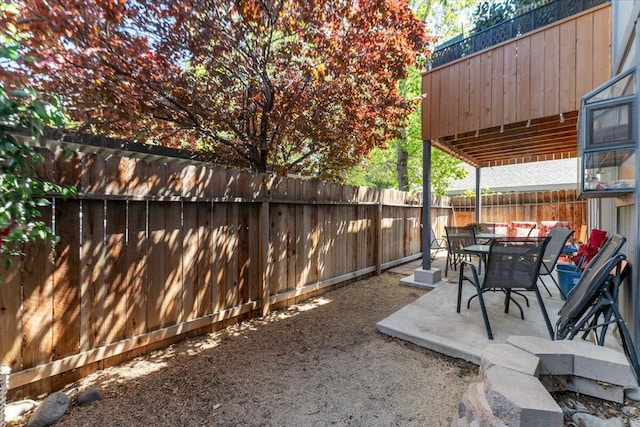 2249 Kietzke Ln Apt C, Reno, NV 89502 - view of patio with a fenced backyard and outdoor dining space