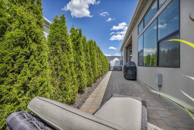 107 Bridlemoor Ct, Reno, NV 89511 - view of patio with a grill and fence