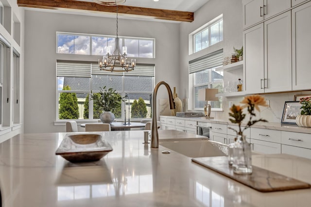 107 Bridlemoor Ct, Reno, NV 89511 - dining area featuring a chandelier, beam ceiling, and a towering ceiling