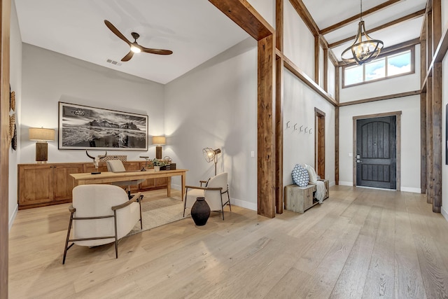 107 Bridlemoor Ct, Reno, NV 89511 - foyer entrance featuring high vaulted ceiling, ceiling fan, light wood finished floors, a chandelier, and baseboards