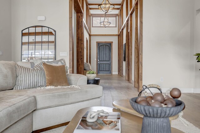 107 Bridlemoor Ct, Reno, NV 89511 - living area with a chandelier, wood finished floors, a high ceiling, and baseboards