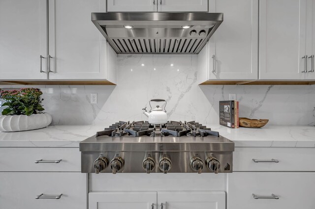 107 Bridlemoor Ct, Reno, NV 89511 - kitchen with wall chimney exhaust hood, stainless steel gas cooktop, backsplash, and white cabinets