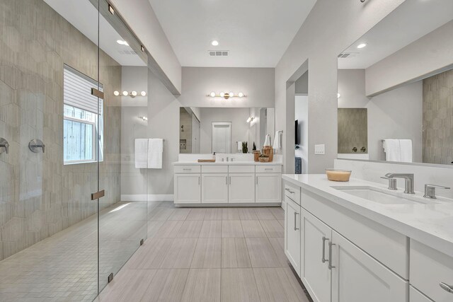107 Bridlemoor Ct, Reno, NV 89511 - bathroom featuring a stall shower, two vanities, and tile patterned flooring