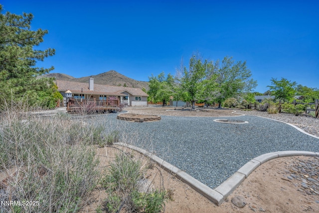 1408 N Santa Barbara Dr, Minden, NV 89423 - view of yard with a deck with mountain view