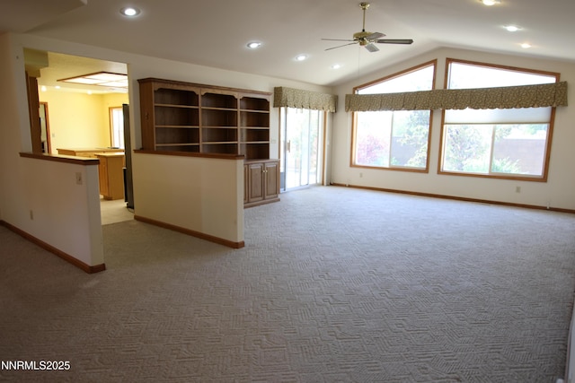 403 Ironwood Ct, Yerington, NV 89447 - unfurnished living room with ceiling fan, light colored carpet, baseboards, lofted ceiling, and recessed lighting