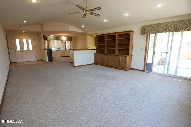 403 Ironwood Ct, Yerington, NV 89447 - unfurnished living room with light carpet, baseboards, vaulted ceiling, ceiling fan, and recessed lighting