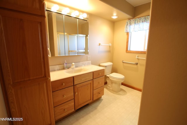 403 Ironwood Ct, Yerington, NV 89447 - full bathroom with tile patterned floors, vanity, toilet, and baseboards