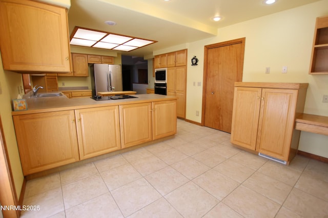 403 Ironwood Ct, Yerington, NV 89447 - kitchen featuring black appliances, a sink, light brown cabinetry, a peninsula, and recessed lighting