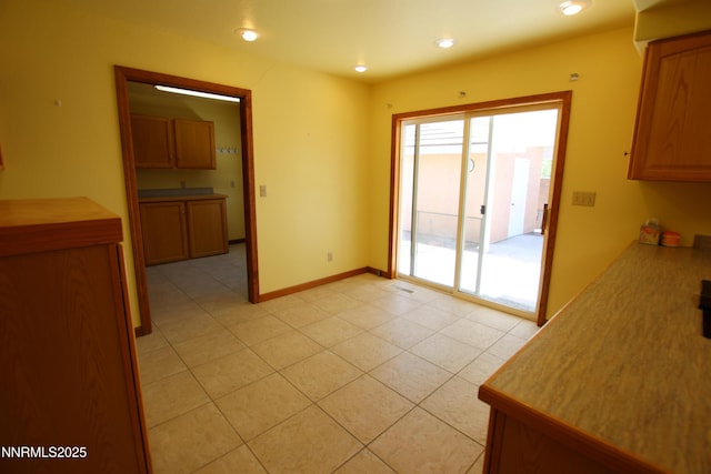 403 Ironwood Ct, Yerington, NV 89447 - unfurnished dining area featuring light tile patterned flooring, baseboards, and recessed lighting