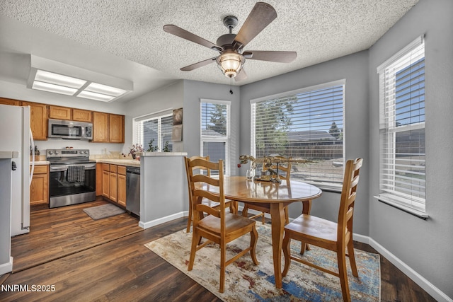 45 Stormy Ct, Sparks, NV 89436 - dining area with plenty of natural light, ceiling fan, a textured ceiling, and dark wood-style flooring