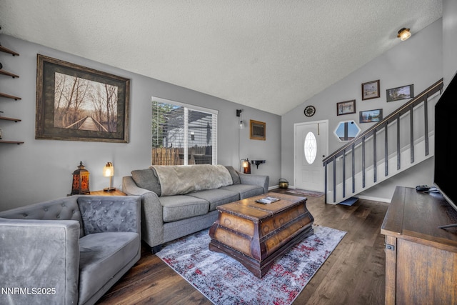 45 Stormy Ct, Sparks, NV 89436 - living area with a textured ceiling, dark wood-style flooring, healthy amount of natural light, stairs, and high vaulted ceiling