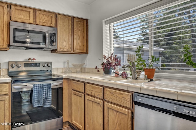 45 Stormy Ct, Sparks, NV 89436 - kitchen featuring appliances with stainless steel finishes, a sink, and brown cabinetry