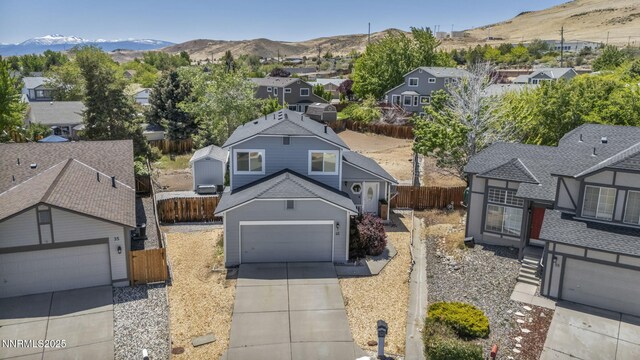 45 Stormy Ct, Sparks, NV 89436 - view of front of house featuring driveway, a residential view, and a mountain view