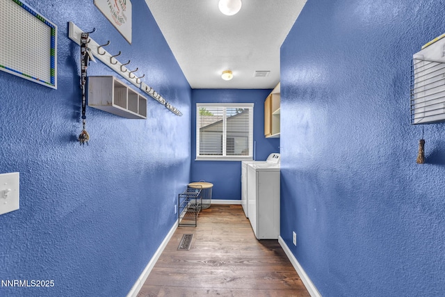 45 Stormy Ct, Sparks, NV 89436 - hall featuring a textured wall, wood finished floors, washing machine and dryer, and baseboards