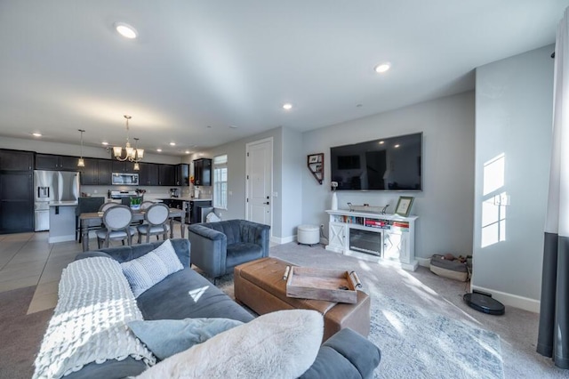 1855 Dark Horse Rd Unit B, Reno, NV 89521 - living room featuring a chandelier, baseboards, recessed lighting, and light colored carpet