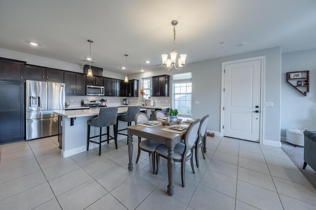 1855 Dark Horse Rd Unit B, Reno, NV 89521 - dining space featuring recessed lighting, a chandelier, light tile patterned flooring, and baseboards