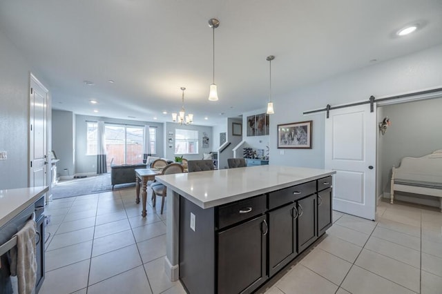 1855 Dark Horse Rd Unit B, Reno, NV 89521 - kitchen with open floor plan, light tile patterned flooring, light countertops, a barn door, and a chandelier
