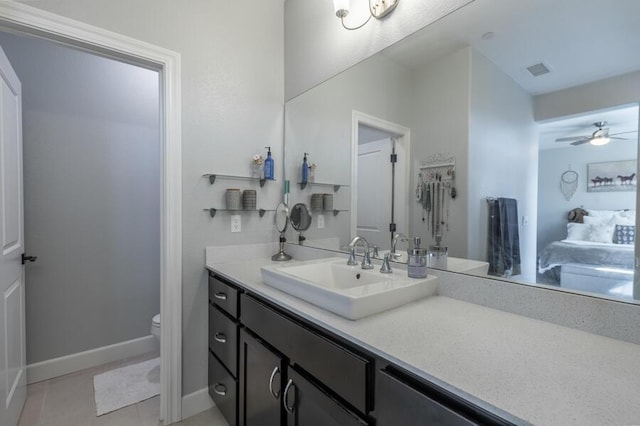 1855 Dark Horse Rd Unit B, Reno, NV 89521 - bathroom with vanity, toilet, baseboards, tile patterned floors, and a ceiling fan