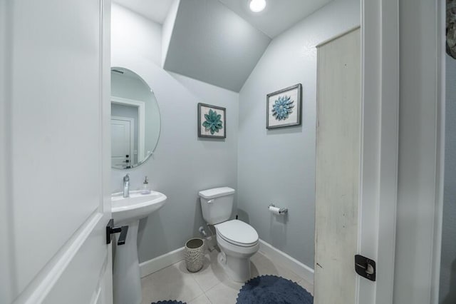 1855 Dark Horse Rd Unit B, Reno, NV 89521 - bathroom featuring toilet, lofted ceiling, baseboards, and tile patterned floors