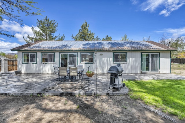3760 Brant St, Reno, NV 89508 - rear view of house with metal roof and a patio